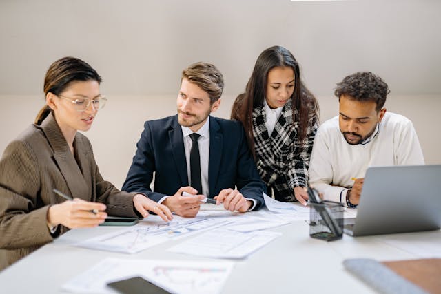 Small business owner reviewing Business Overhead Expense Insurance options in Ontario.