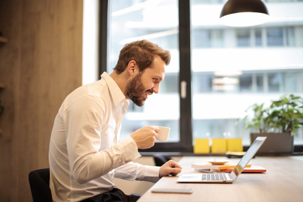 Ontario Business owner with family photos on desk symbolizing protection for both business and family. why you need to know BOE Insurance vs Disability Insurance